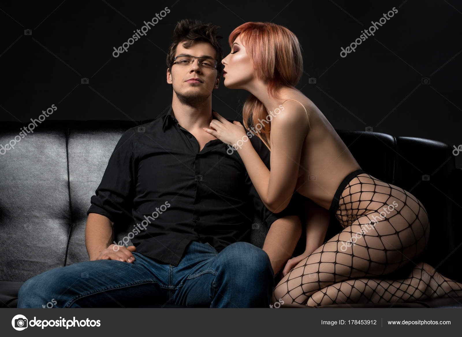 Sexy young couple on a black leather sofa shot Stock Photo by ©Wisky 178453912 image