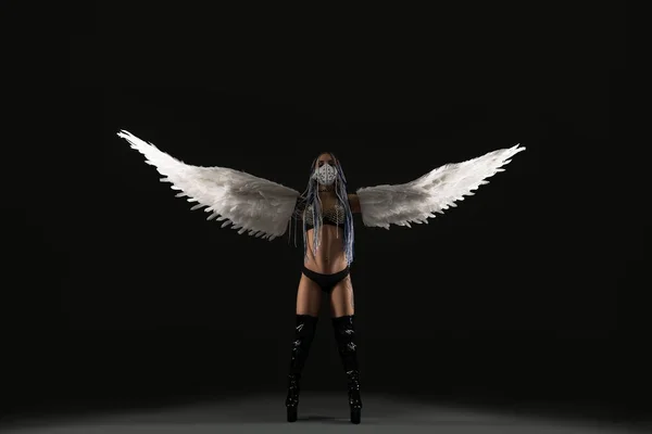 Conceptual shot of a sexy woman with white wings — Stock Photo, Image