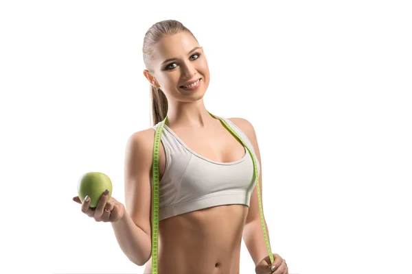 Fitness-Trainer mit Apfel und Maßband — Stockfoto