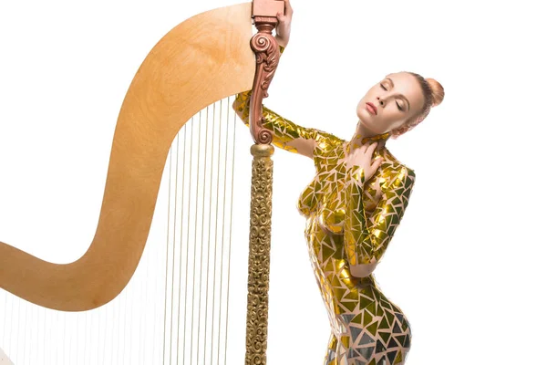 Sexy meisje weergave met een luxe muzikale harp — Stockfoto