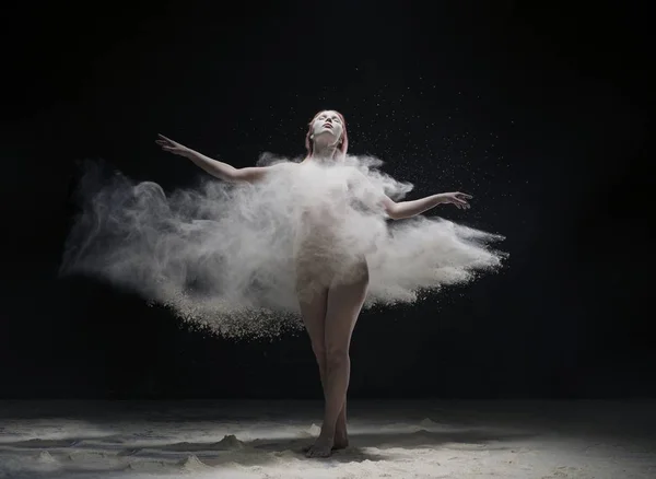 Woman dancing gracefully in dust cloud view — Stock Photo, Image