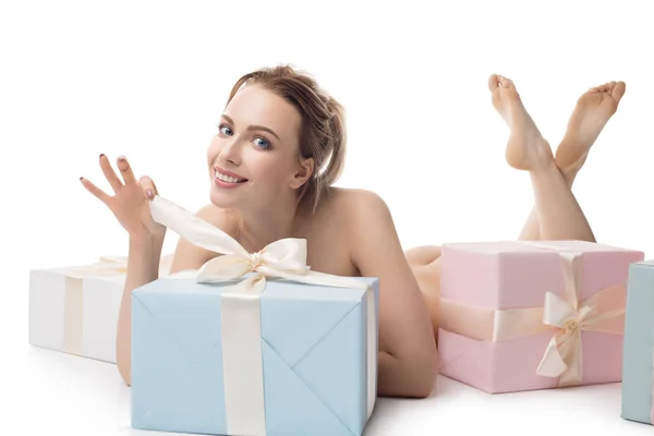 Naked pretty girl and color gift boxes on floor — Stock Photo, Image