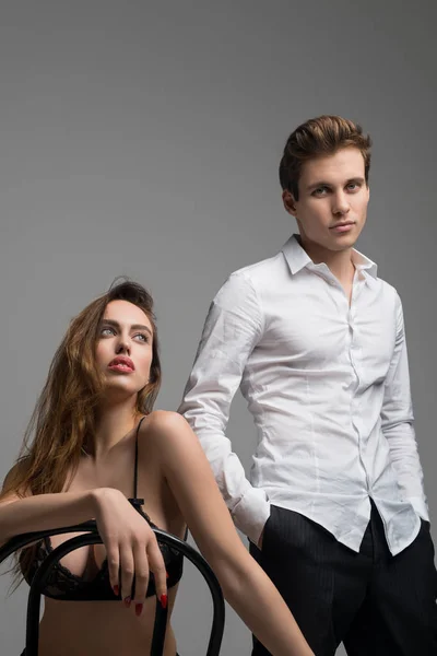 Sexy caballero y mujer en lencería recortado tiro — Foto de Stock