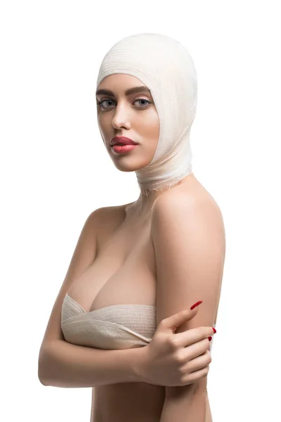 Girl her head and neck bandaged at plastic surgeon — Stock Photo, Image