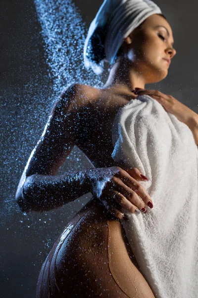 Nude beautiful woman having shower low angle view — Stock Photo, Image