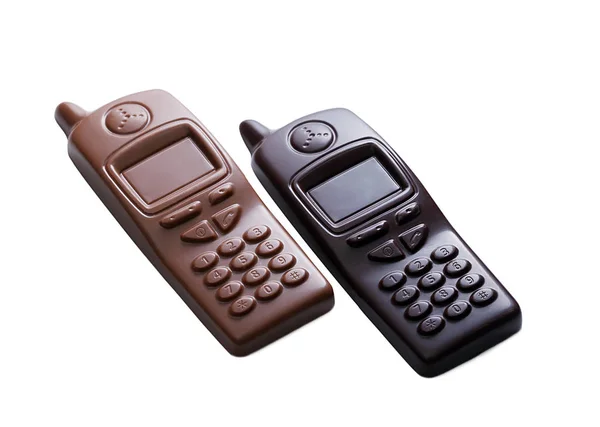 Teléfonos celulares hechos de chocolate oscuro y leche — Foto de Stock