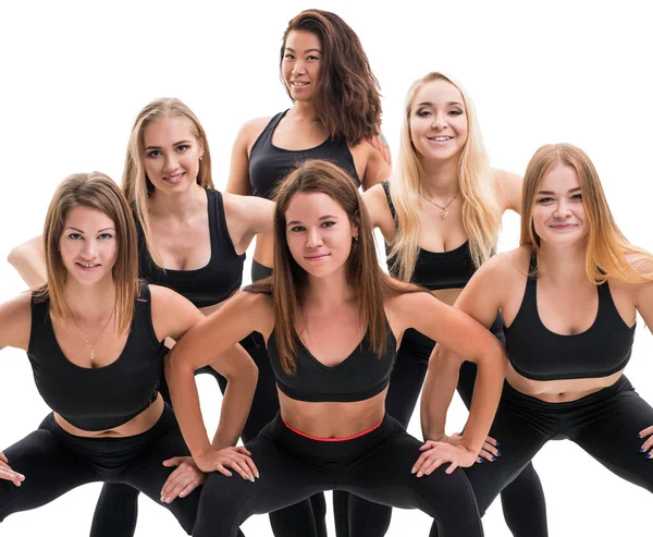 Mooie fitness trainers in zwarte tops en leggings — Stockfoto