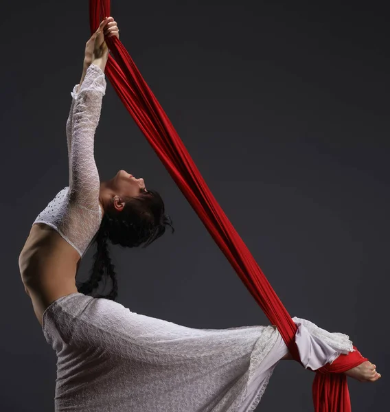 Young woman exercising on aerial cloth — Stock Photo, Image
