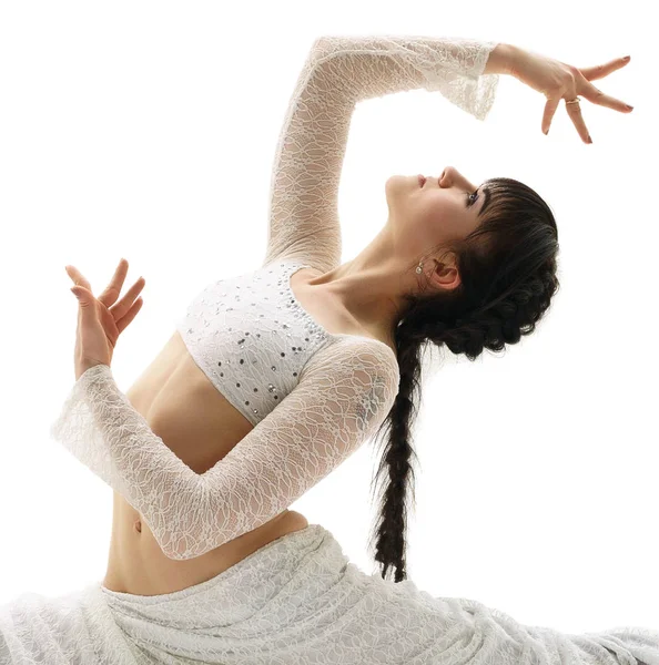 Young gymnast sitting in graceful split in studio — Stock Photo, Image