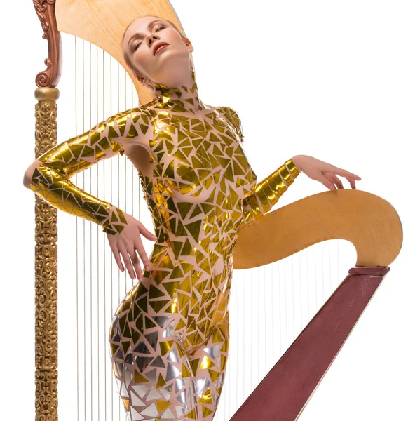 Menina sexy tiro com uma harpa musical de luxo — Fotografia de Stock