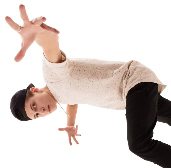 Young handsome rap dancer in baseball cap jumping — Stock Photo, Image