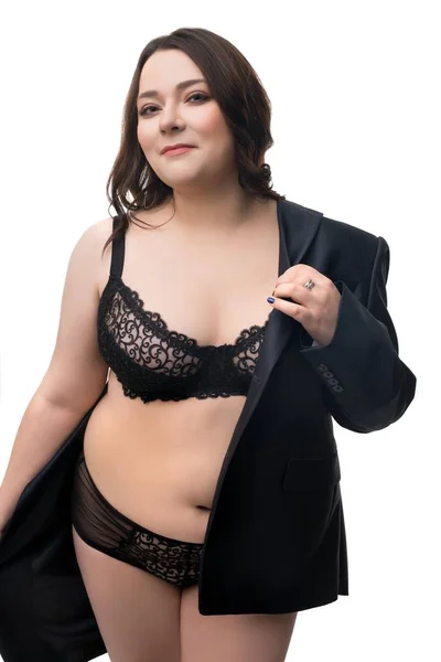 Coquettish overweight lady in lingerie and jacket — Stock Photo, Image