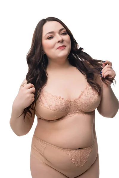 Vet vrouw in beige lingerie geïsoleerd uitzicht — Stockfoto