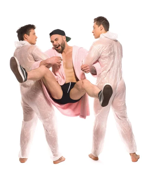 Homosexual men taking away heterosexual guy — Stock Photo, Image