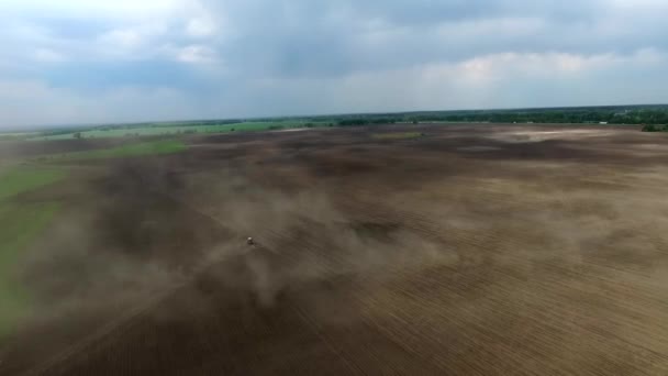 Harvester plowing field in spring — Stock Video