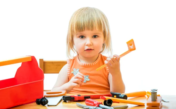 Criança com ferramentas de brinquedo — Fotografia de Stock