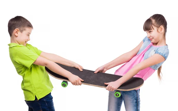 Boy and girl pulling skate on sides — Stock Photo, Image