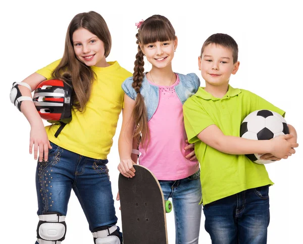 Niños juguetones sosteniendo equipo deportivo en las manos — Foto de Stock