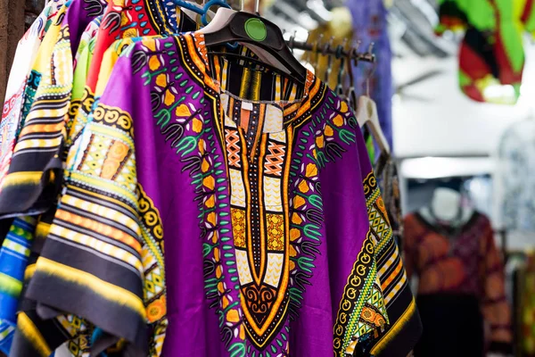 Beautiful colorful clothes at african market — Stock Photo, Image
