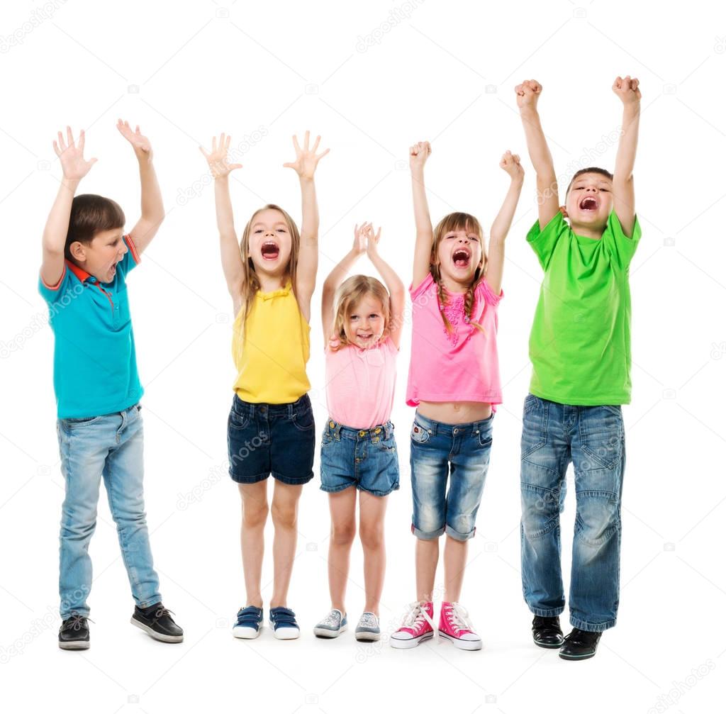 joyful laughing children with hands up