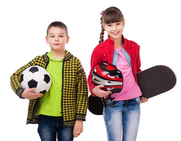 Niños juguetones sosteniendo equipo deportivo en las manos —  Fotos de Stock