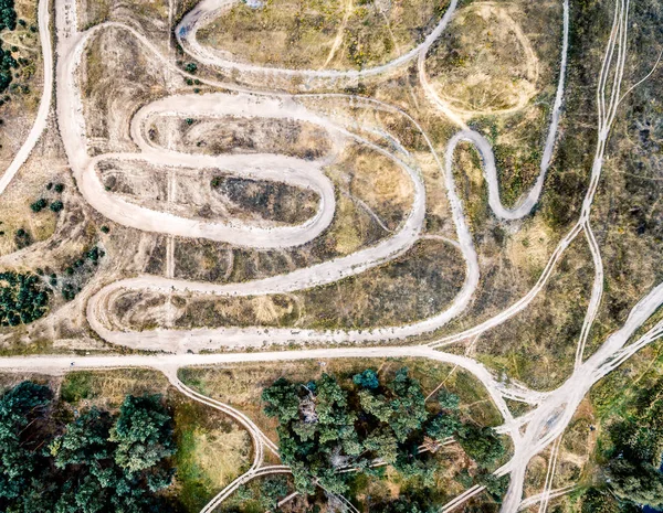 Rolled tracks in countryside terrain, top view — Stock Photo, Image
