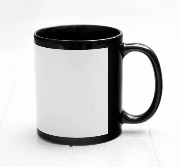 Big mug, black inside with white square — Stock Photo, Image