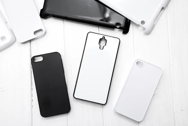 Different black and white cellphone cases, topshot — Stock Photo, Image