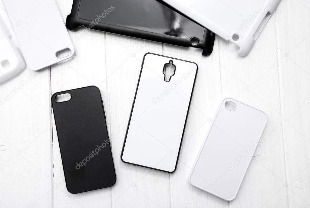 Different black and white cellphone cases, topshot