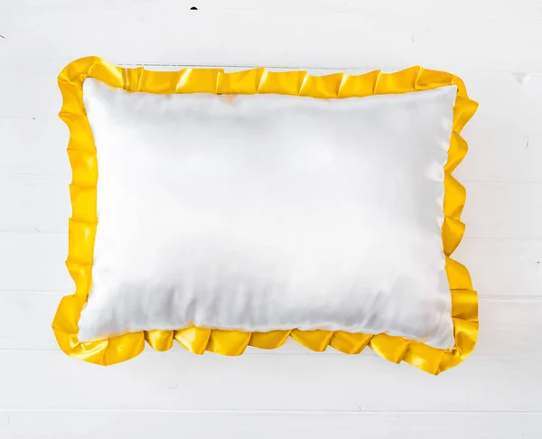 White pillow with golden frill — Stock Photo, Image