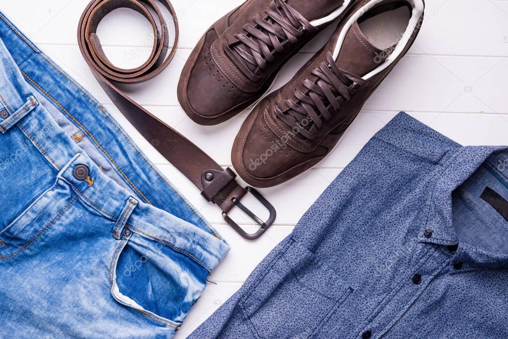 male jeans and shirt with brown belt and shoes