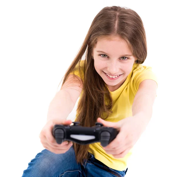 Menina sorrindo amplamente, usando joystick, pronto para ganhar — Fotografia de Stock