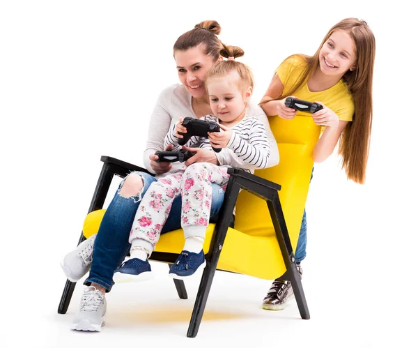 Family playing computer games with joystick — Stock Photo, Image