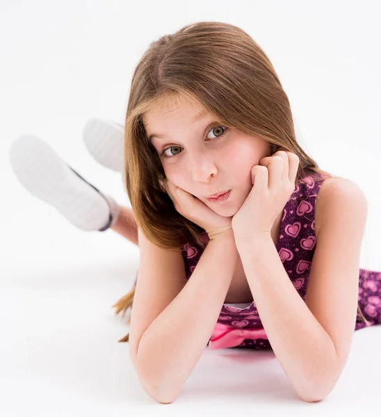 Lovely teenage girl lying on the floor, smiling — Stock Photo, Image