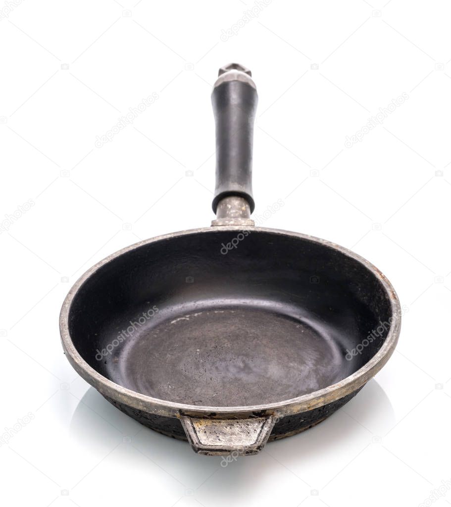 Small cast iron frying pan isolated on white background