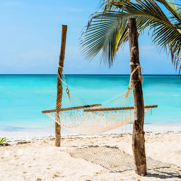 Beautiful seascape with hammock on a beach — Stock Photo, Image