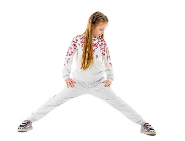 Bambina fare stretching isolato su sfondo bianco — Foto Stock