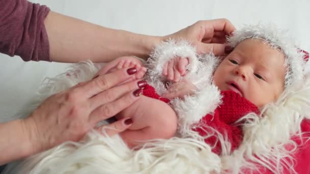 Tiny baby dressed as Santa Claus — Stock Video