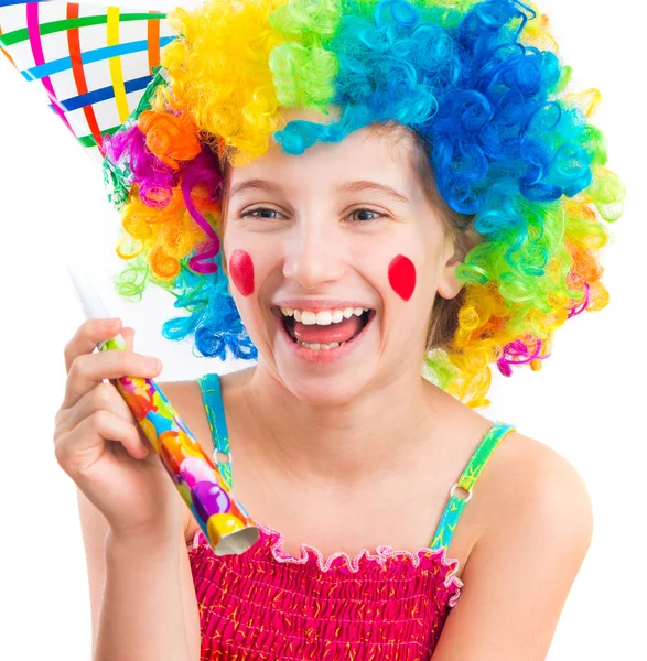 Cheerful girl in curly clown wig and party horn blower — Stock Photo, Image