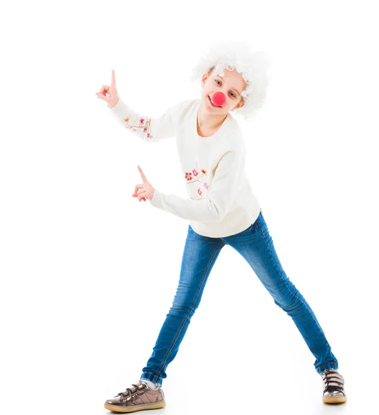 Teenage girl in clown wig pointing up — Stock Photo, Image