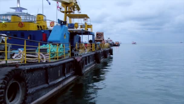 Tugboat moored in harbor in Batumi port — Stock Video