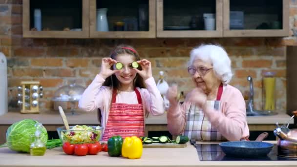 Grandchild with granny having fun — Stock Video