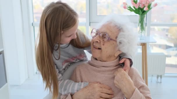 Tender hugs of granddaughter and grandmother — 비디오