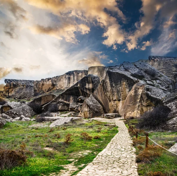 Gobustan national park ancient rocks at sunset — Stock Photo, Image