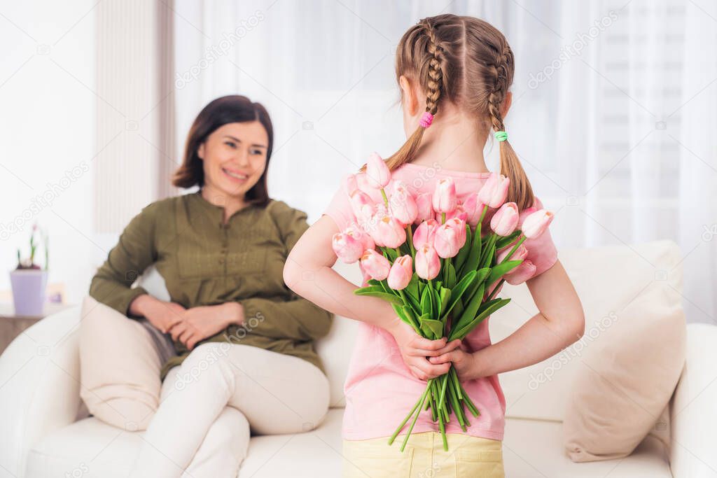 Teen girl preparing surprise for mother