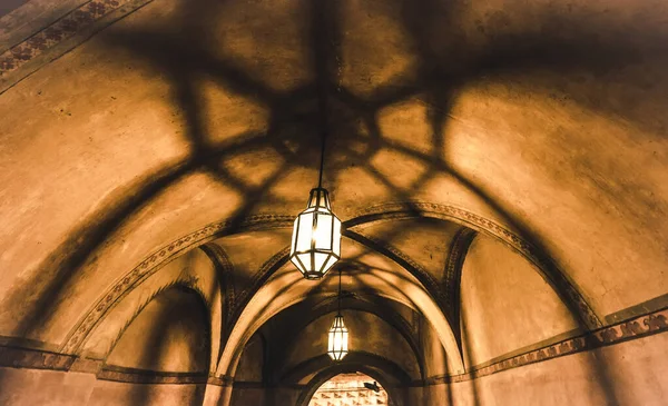 Light from the lamp and the shadows in the mysterious corridor — Stock Photo, Image