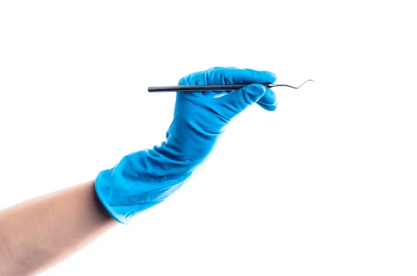 Hand in blue glove holding dental metal stick isolated — Stock Photo, Image