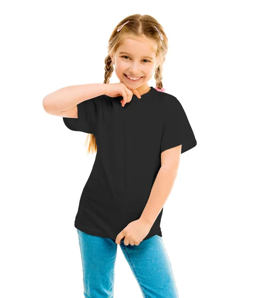 Nettes kleines Mädchen in schwarzem T-Shirt und blauer Jeans — Stockfoto