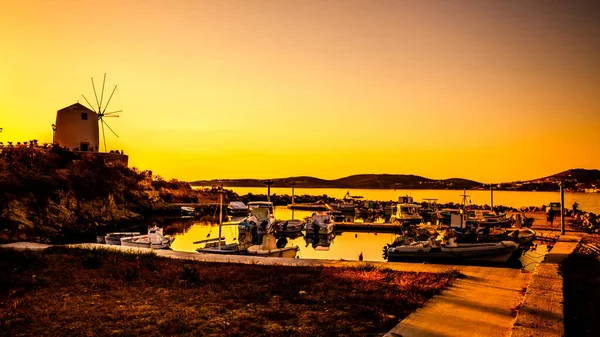 Fishing pier with ships in evening — Stock Photo, Image