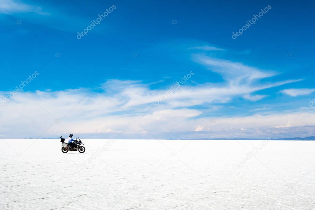 Tourist riding on motorbike in Salar de Uyuni